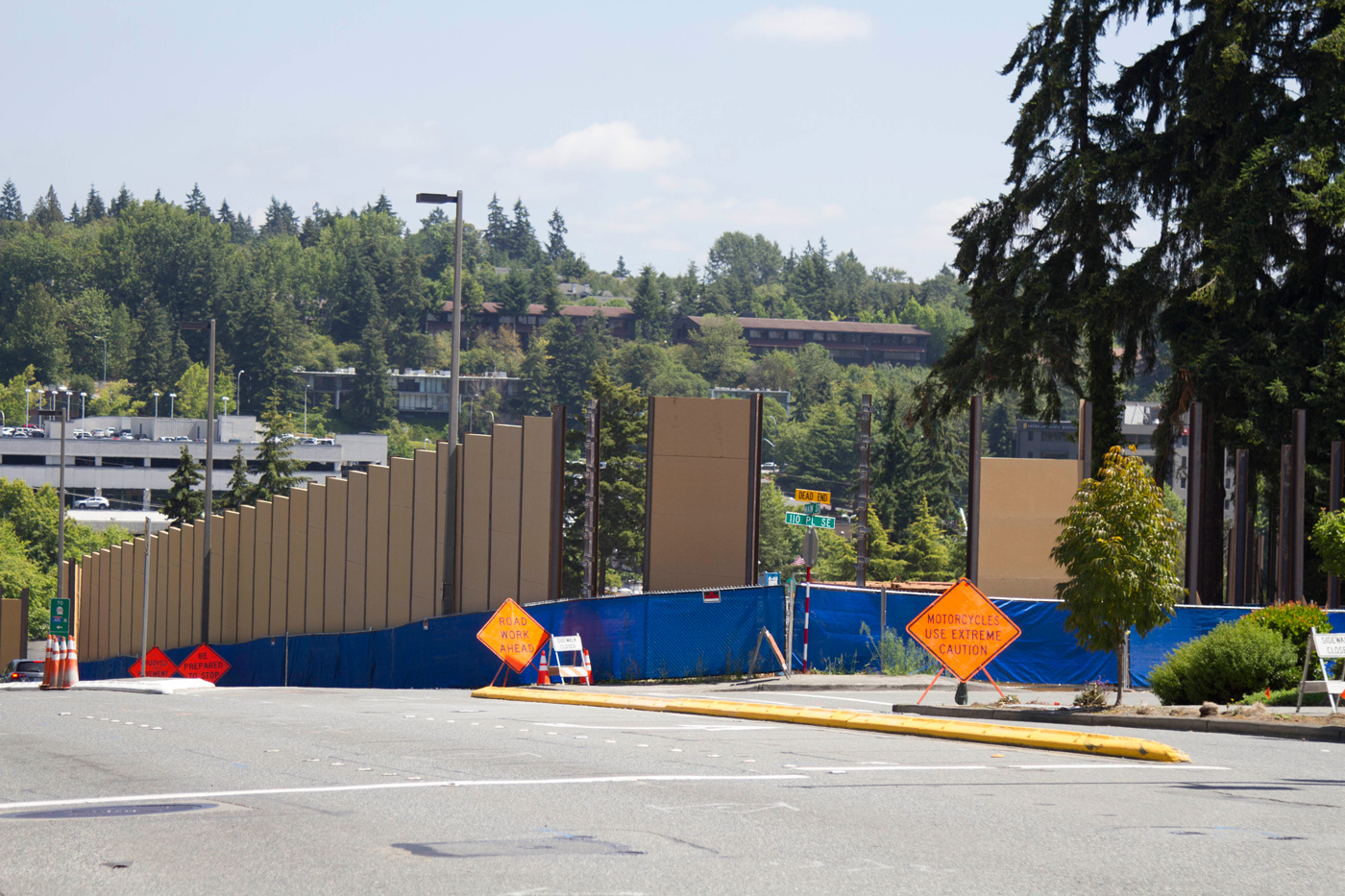 Construction of the temporary sound wall around the south tunnel portal site at Main Street and 112th Avenue NE. 