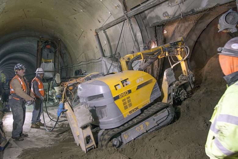 Contractors use remote-controlled excavators to mine each cross passage.