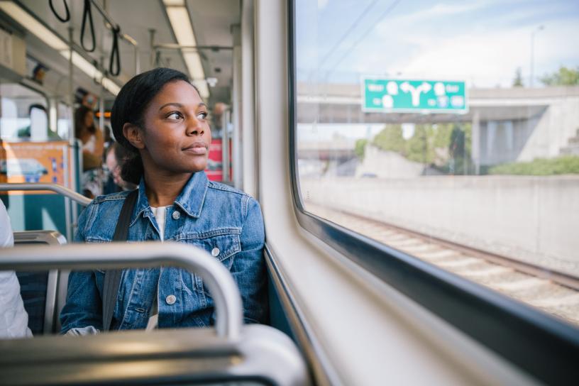 Passenger looks out the window while riding the Link light rail.