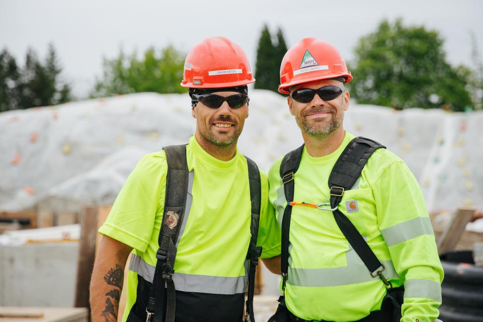Richard Laffey smiles with his brother Caleb Hatch. They both work on Sound Transit's East Link project.