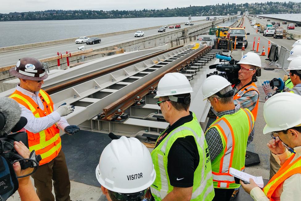 Sound Transit staff explain to media how rails will be installed on the I-90 bridge.