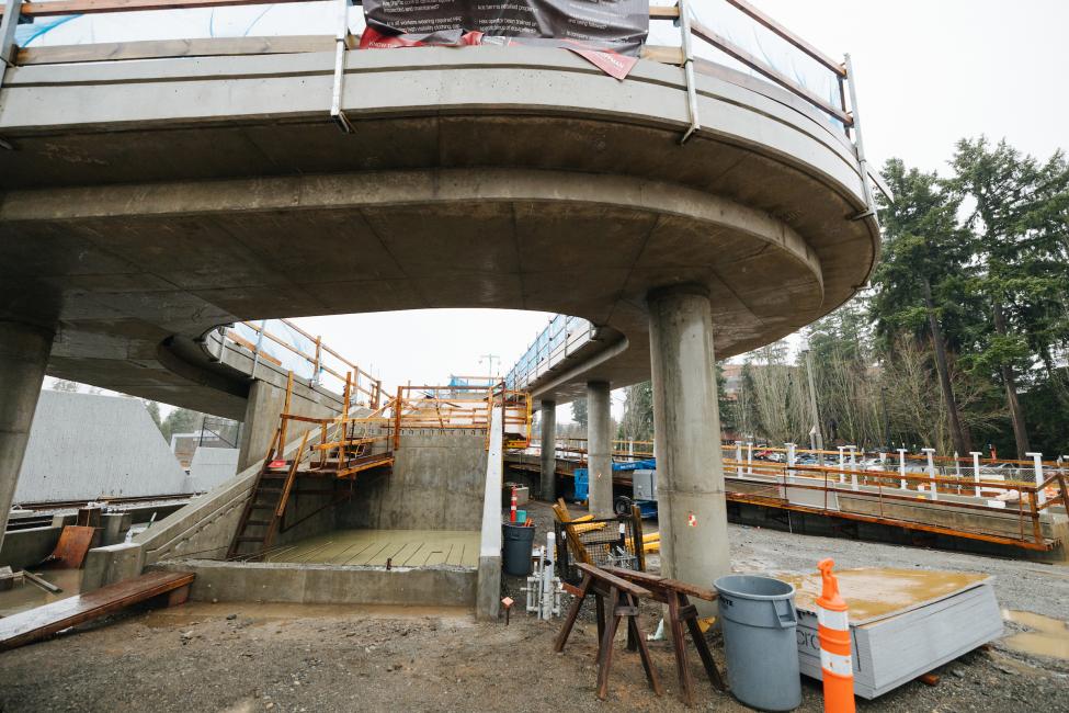 An elevated pedestrian path under construction at Overlake Village Station.