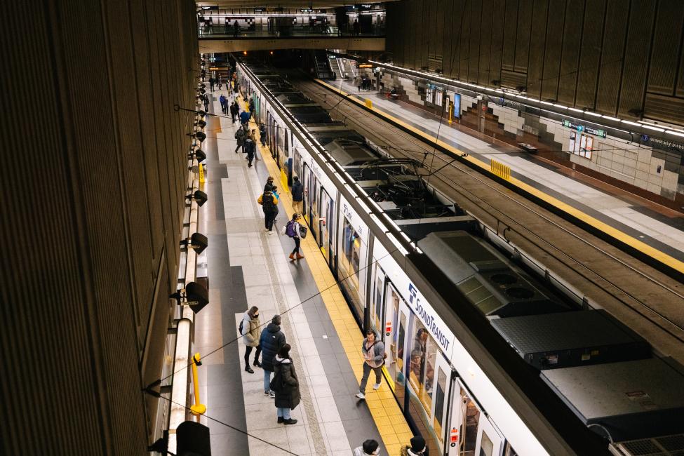 A view from the mezzanine of a Link train pulling into University Street Station