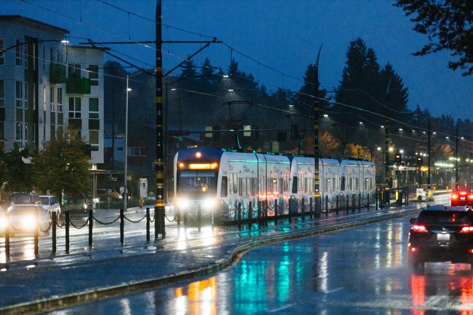 A Link train in the Rainier Valley on a rainy evening