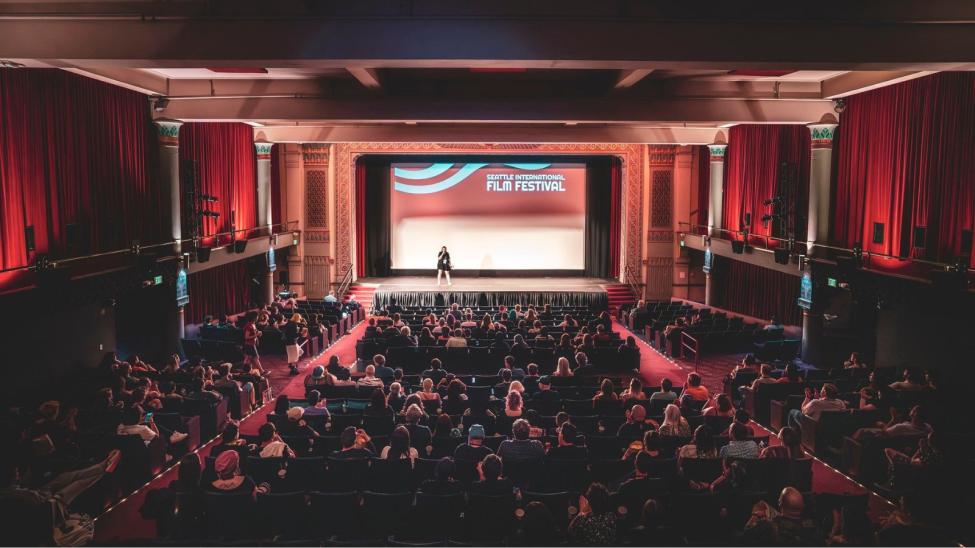 A theater full of patrons screens a Seattle International Film Festival feature.