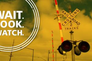 A graphic depicts a rail crossing with the text "Wait. Look. Watch."