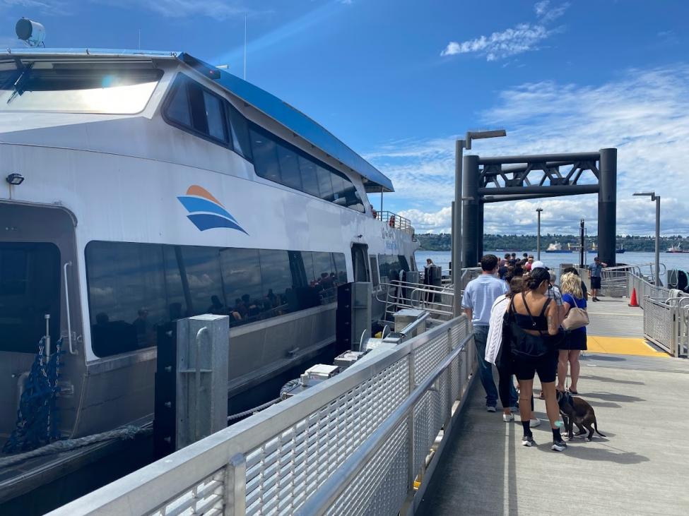A line of people waits to board the King County Water Taxi to West Seattle.