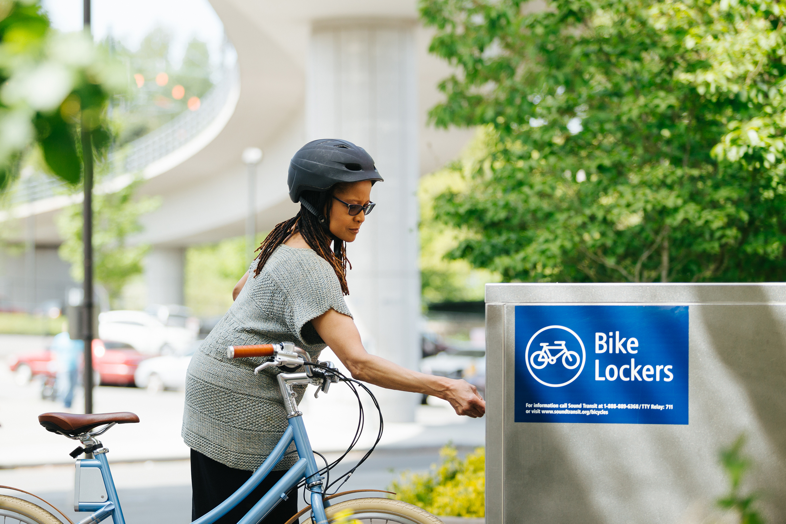 Bike rider using a Sound Transit bike locker