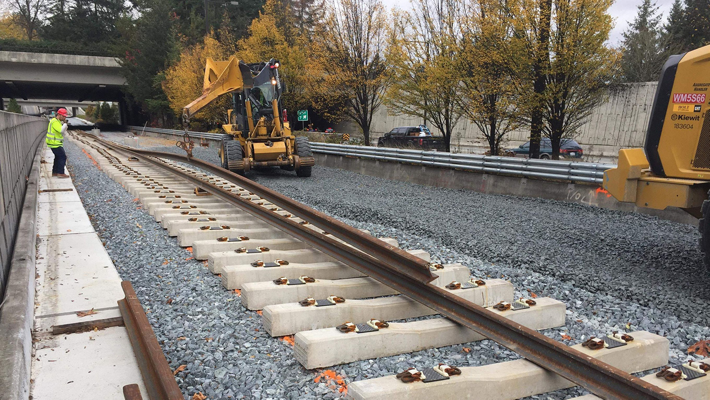 960-foot-long sections of rail are then threaded through clips on either end of the concrete tie.