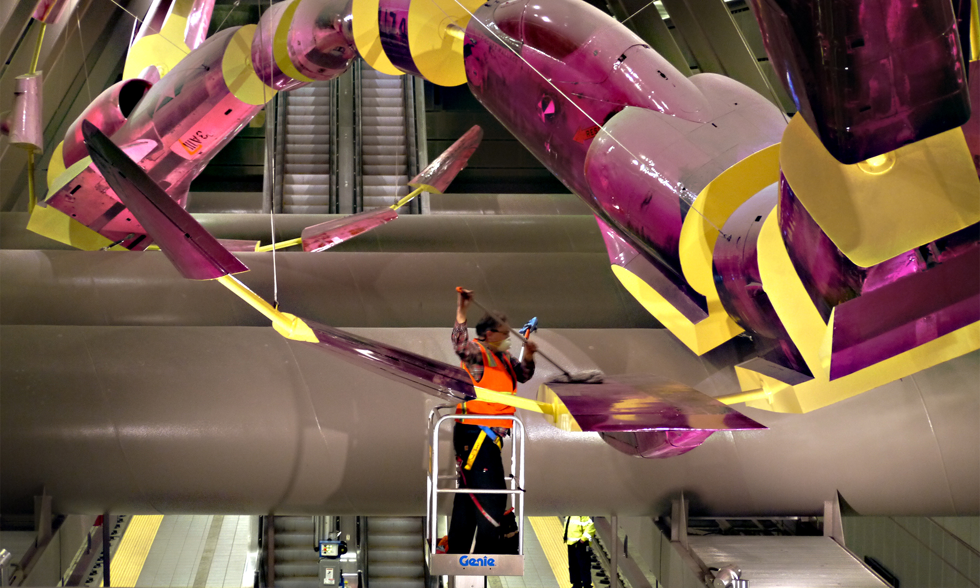 Sound Transit art maintenance man prepares to clean Jet Kiss at Capitol Hill Station