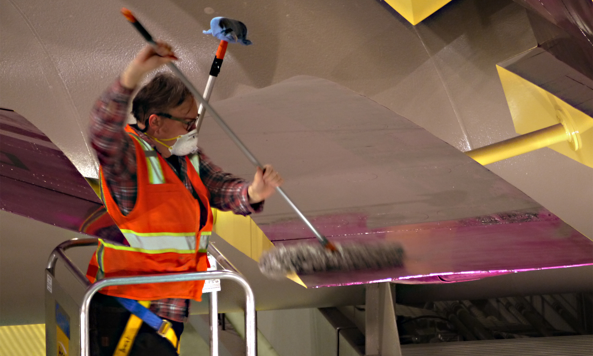 Sound Transit art maintenance man prepares to clean Jet Kiss at Capitol Hill Station