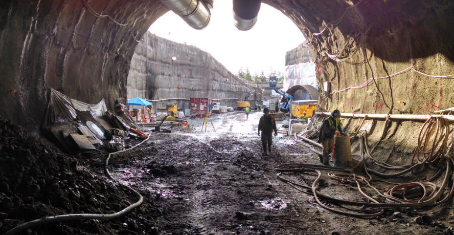 Crew members stand at the south tunnel portal entrance, located at 112th Avenue NE and Main Street.