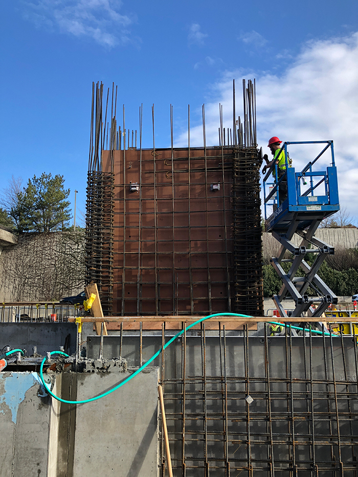 Wood forms and steel rebar are installed to prepare to pour the concrete elevator shaft at the Mercer Island station's west headhouse.