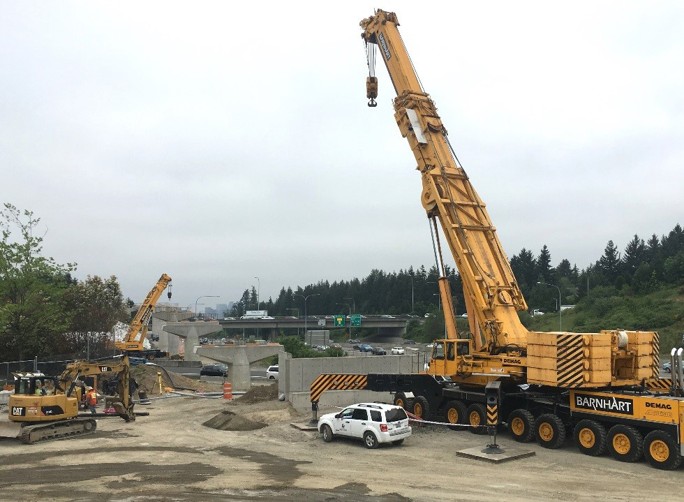 Construction crews will use these cranes to place girders between columns.