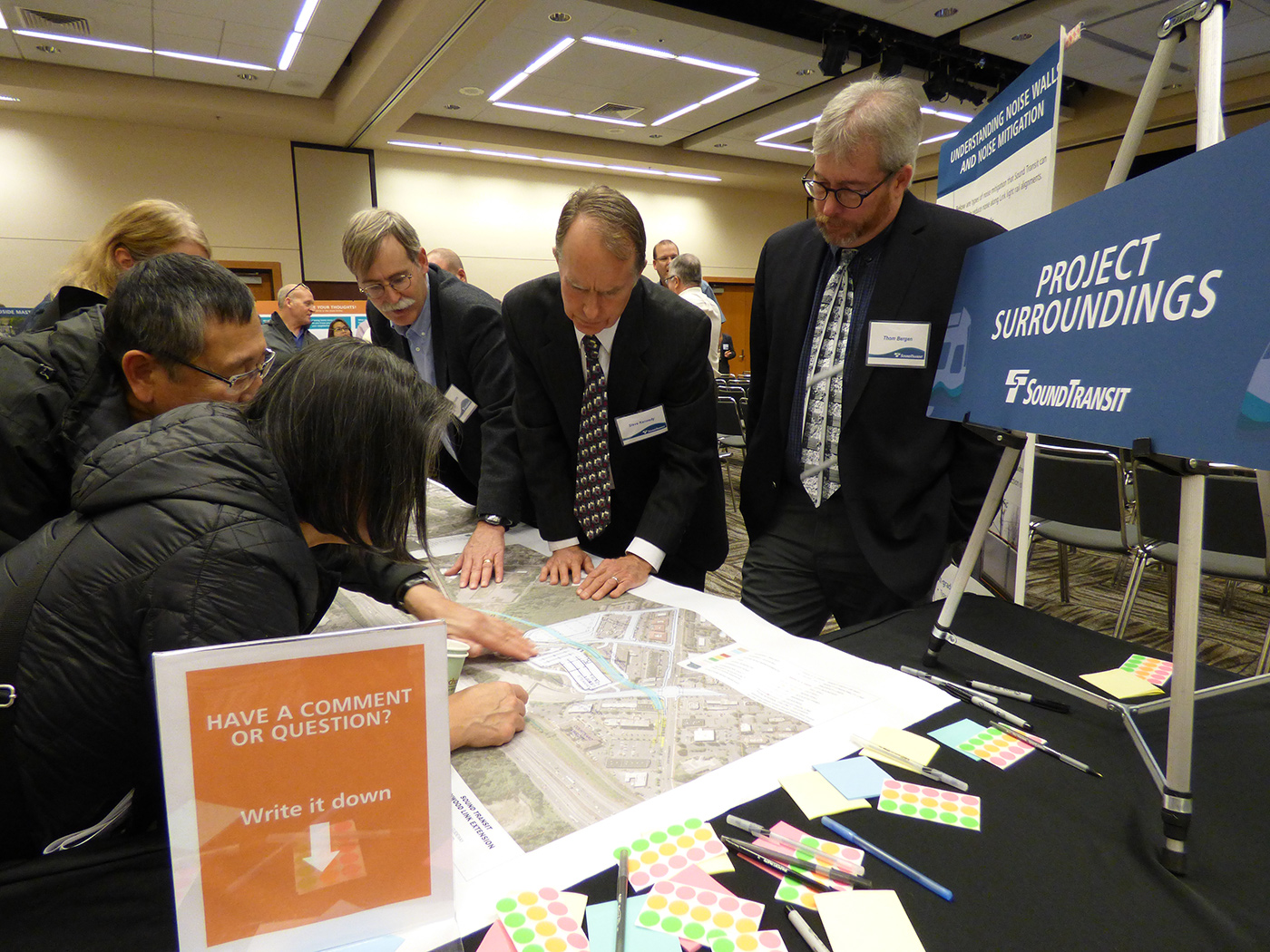 Project team and members of the public review documents at the 30 percent station design open houses in November 2016.