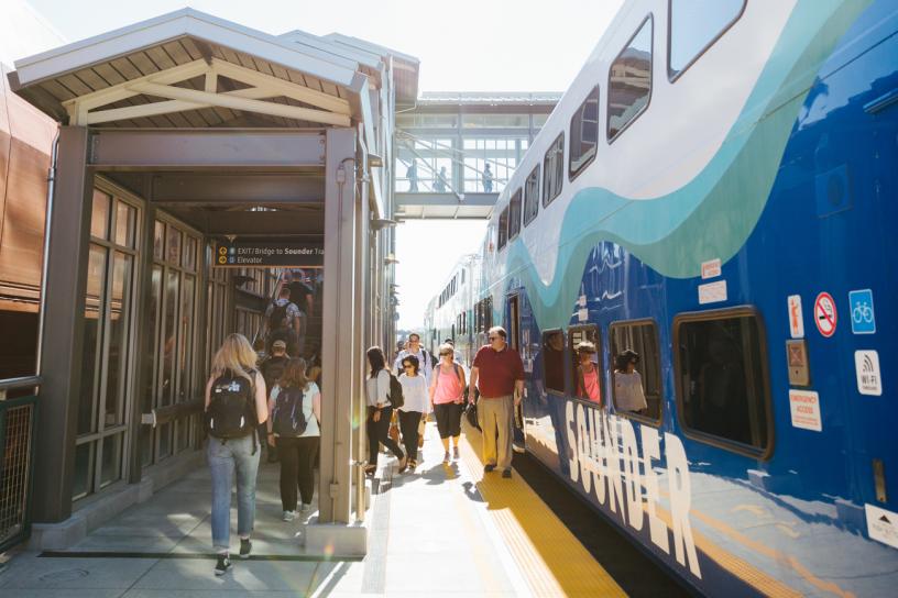 Commuters disembark from a Sounder train at the Mukilteo Sounder Station platform.