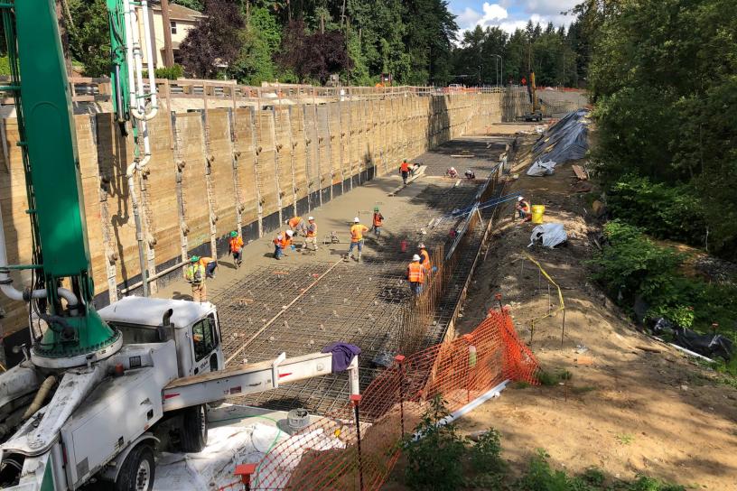 Crews place concrete in the light rail trench adjacent to Bellevue Way Southeast.