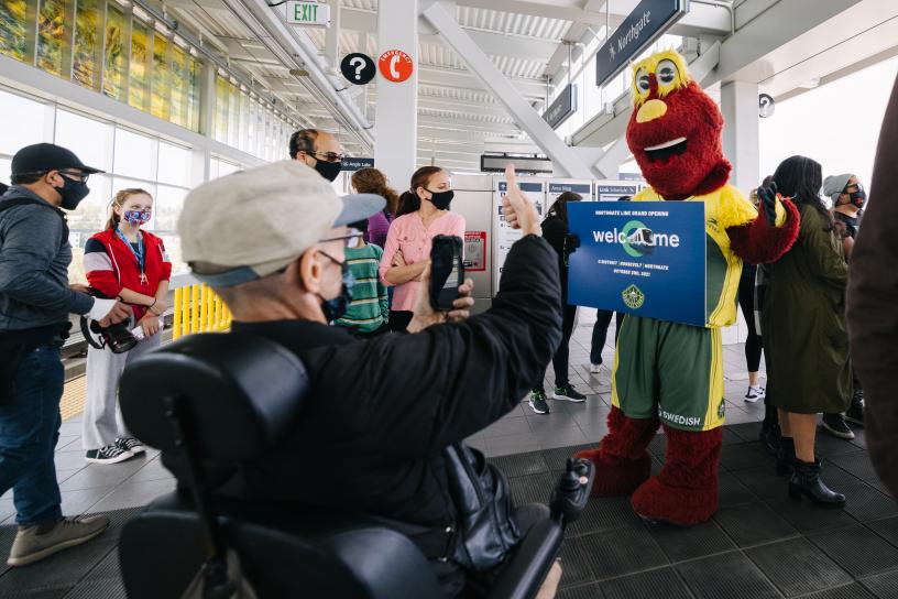 Doppler, the Seattle storm mascot, on a train