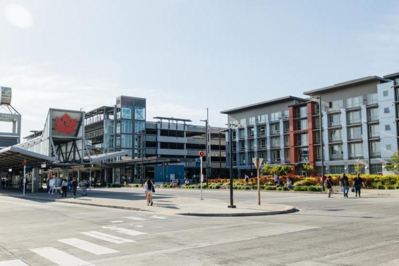 photo of Senior City Transit-Oriented Development project at Federal Way Transit Center with people waiting at and walking around the station