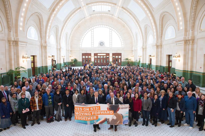 people in Sound Transit Union Station Great Hall celebrating ST3 Vote passing in 2016