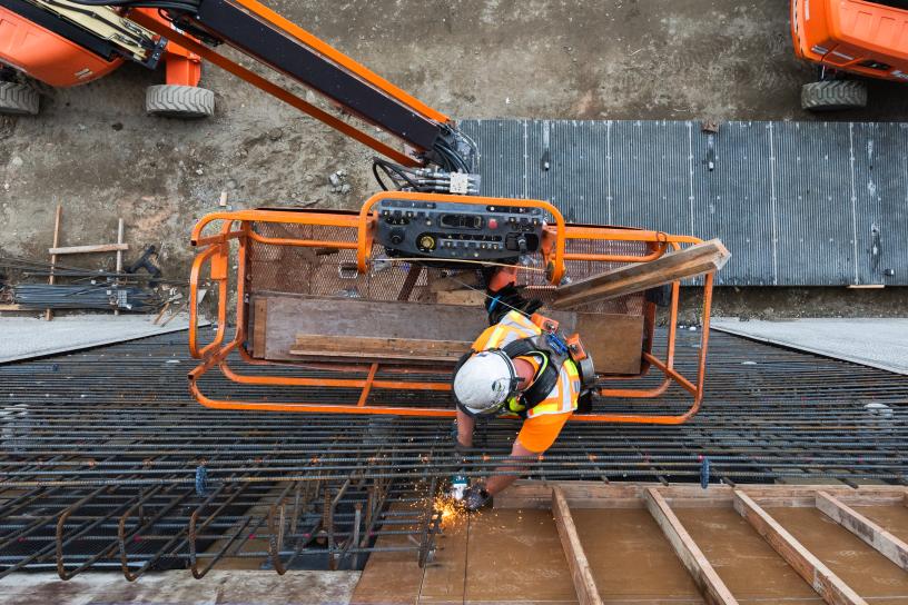 Looking down at a worker in a lift