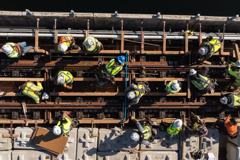 A drone shot of workers placing concrete on the I-90 floating bridge
