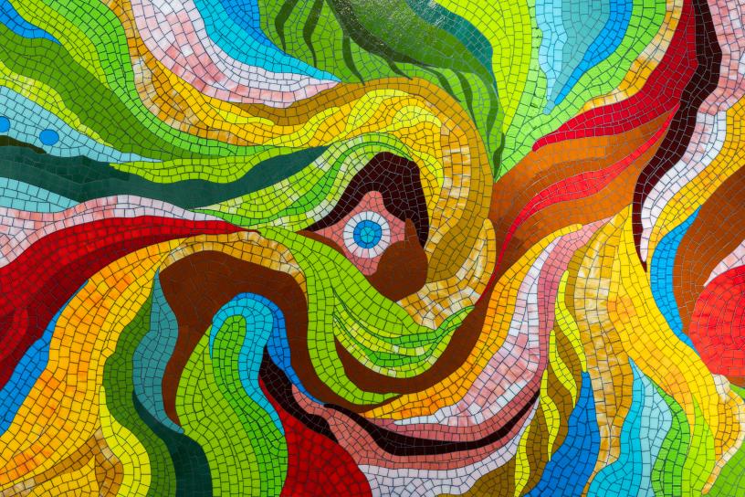 Bright colors - green, red, blue, yellow and more - are used in this mosaic art.