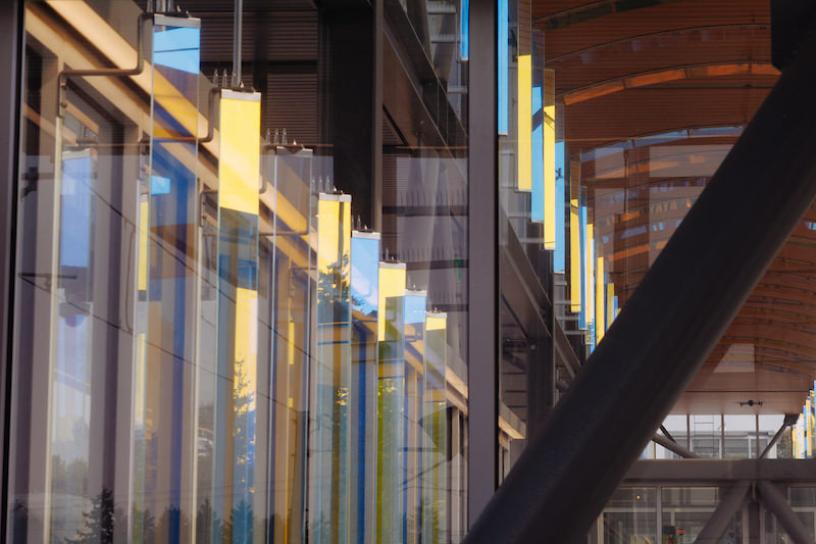 An art installation that reflects light with large glass rectangles located in Federal Way Downtown Station