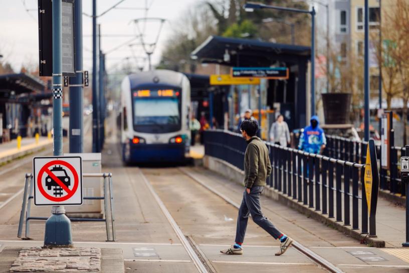 Person using an at-grade crossing in the Rainier Valley