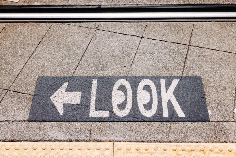 "LOOK" pavement markings were applied throughout the Rainier Valley to increase awareness of the presence of light rail vehicles at areas where pedestrian walkways cross the tracks.