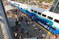 An aerial view of the Auburn Station platform as passengers disembark from a Sounder train.