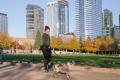 Woman walks her dog in Bellevue Park.