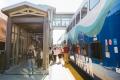 Commuters disembark from a Sounder train at the Mukilteo Sounder Station platform.