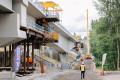 A worker walks to the left of a giant new light rail guideway under construction