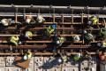 A drone shot of workers placing concrete on the I-90 floating bridge
