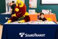 Community members and Seattle Storm mascot "Doppler" during the 2025 Transit Safety Fair.