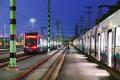 The train yard at OMF Central in Seattle’s SODO neighborhood features artwork called “Safety Spires,” by Norie Sato and Dan Corson. Through color and a simple pattern, Sato and Corson transformed the facility’s overhead catenary system poles into a collection of horsetail reeds. 