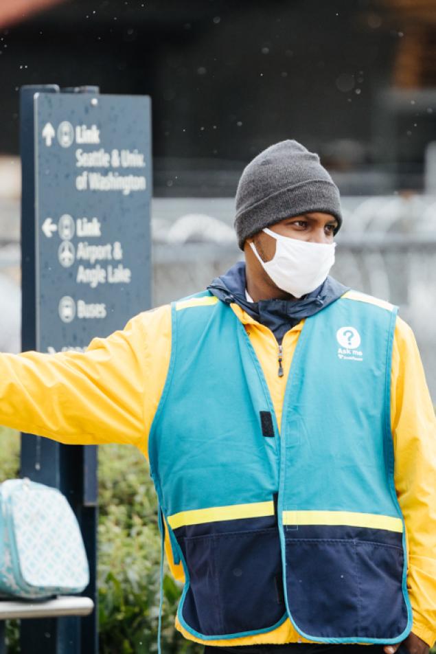 Photo of a landmark staff member providing directional wayfinding