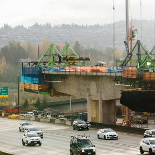 A view of the "traveler" atop one of the East Link columns as it builds a new bridge over the I-90 roadway.
