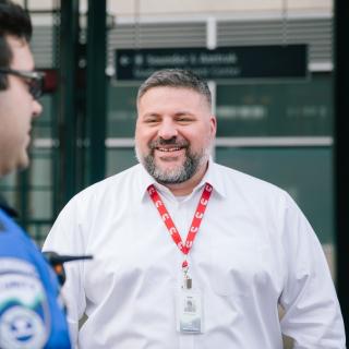 Ken Cummins, Sound Transit Director of Safety and Security jokes with a Security Officer