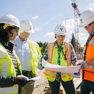 Lynnwood Link Extension construction team reviewing plans