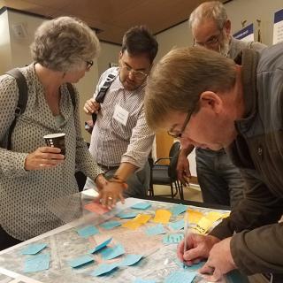 Community members review a map of the BRT alignment.