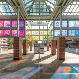 Companion Garden public art at Auburn Sounder Station refraction of colorful light on the ground