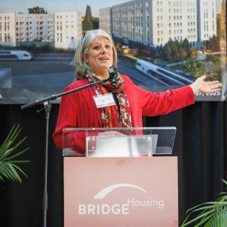 King County Councilmember and Sound Transit Board Vice Chair Claudia Balducci speaks at the groundbreaking ceremony for the Spring District Station transit-oriented development TOD.
