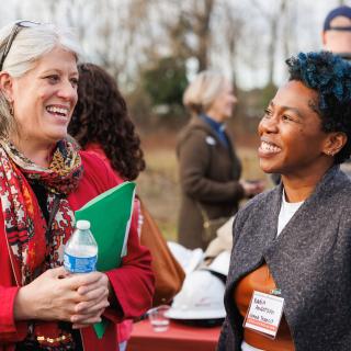 King County Councilmember and Sound Transit Board Vice Chair Claudia Balducci (left) speaks with Sound Transit Chief Strategy Officer Nadia Anderson at the groundbreaking ceremony for the Spring District Station TOD.