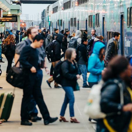 Passengers board a Sounder train.