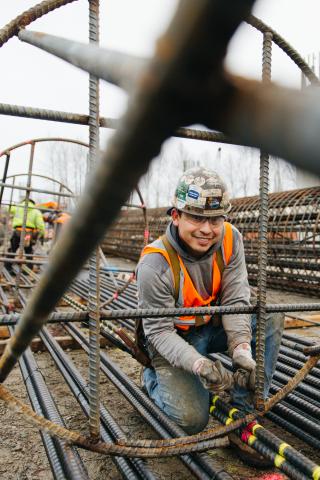 System expansion - worker at Link light rail construction site