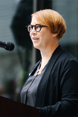 A Sound Transit executive speaking from a lectern.