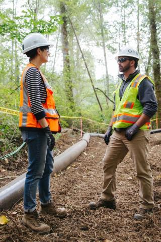 Two Sound Transit employees at an environmental work site.
