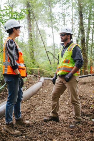 Two Sound Transit employees at an environmental work site.